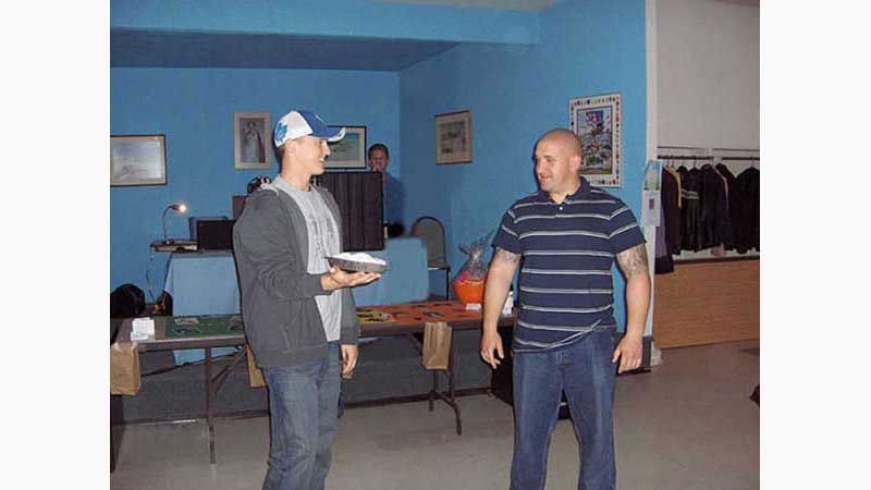 Stag and Doe, DJ Barrie, man holding whip cream pie ready to throw in grooms face. Taken in Barrie Ontario